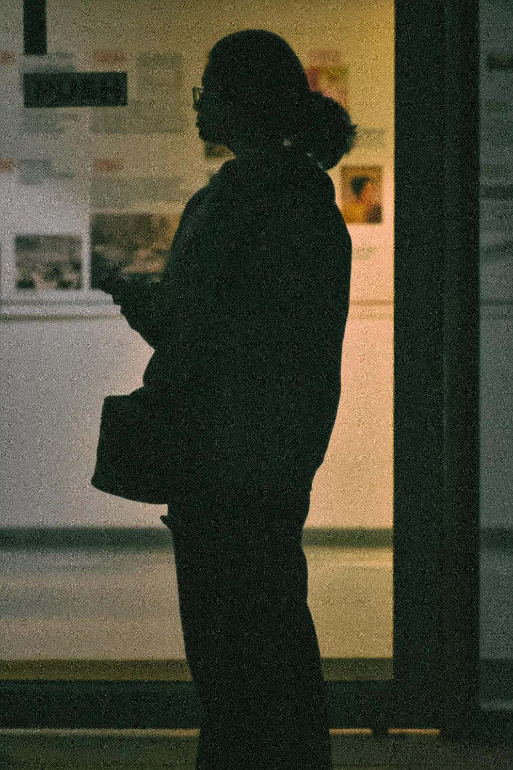 Poised between light and dark, a silhouette of thought. 