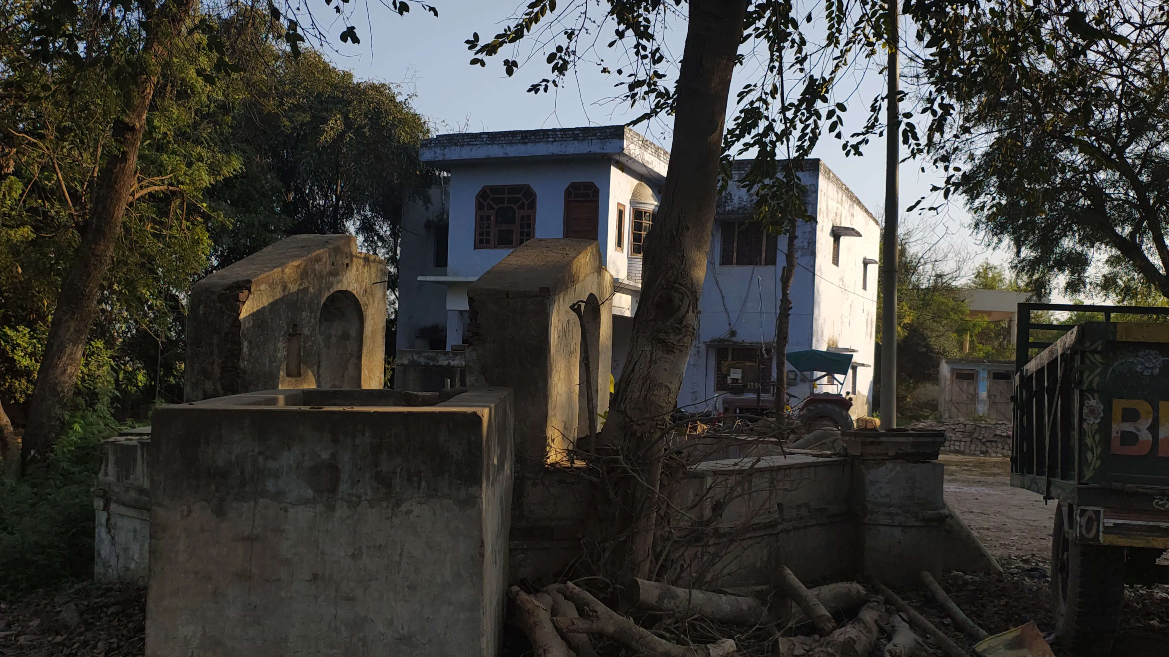 An old well standing beside a Farmhouse